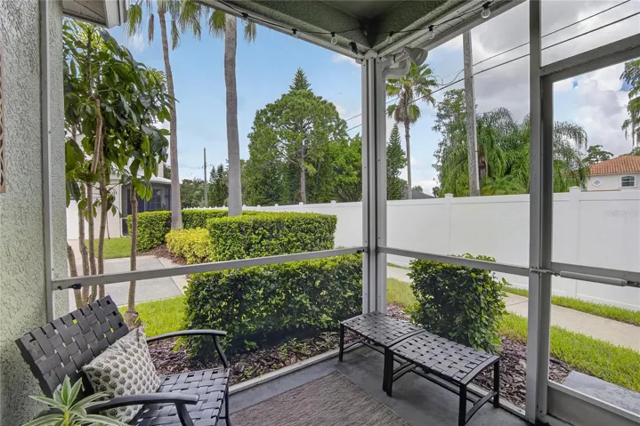 Cozy screened lanai offers a private spot to relax and enjoy the Florida outdoors