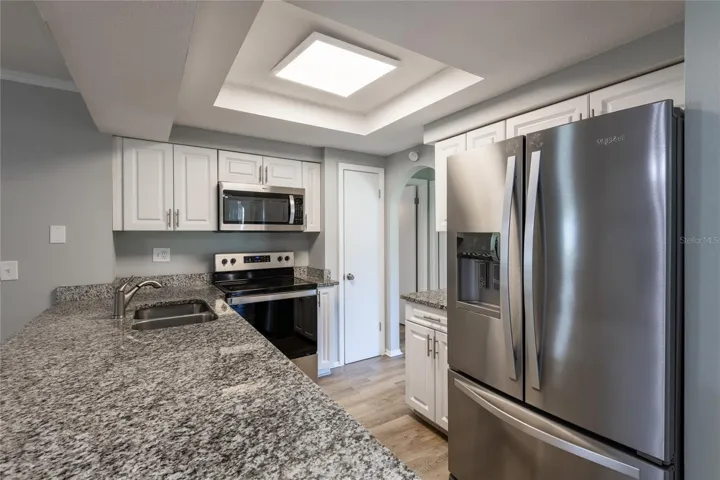 Shaker cabinets with granite counter tops. Newer appliances.
