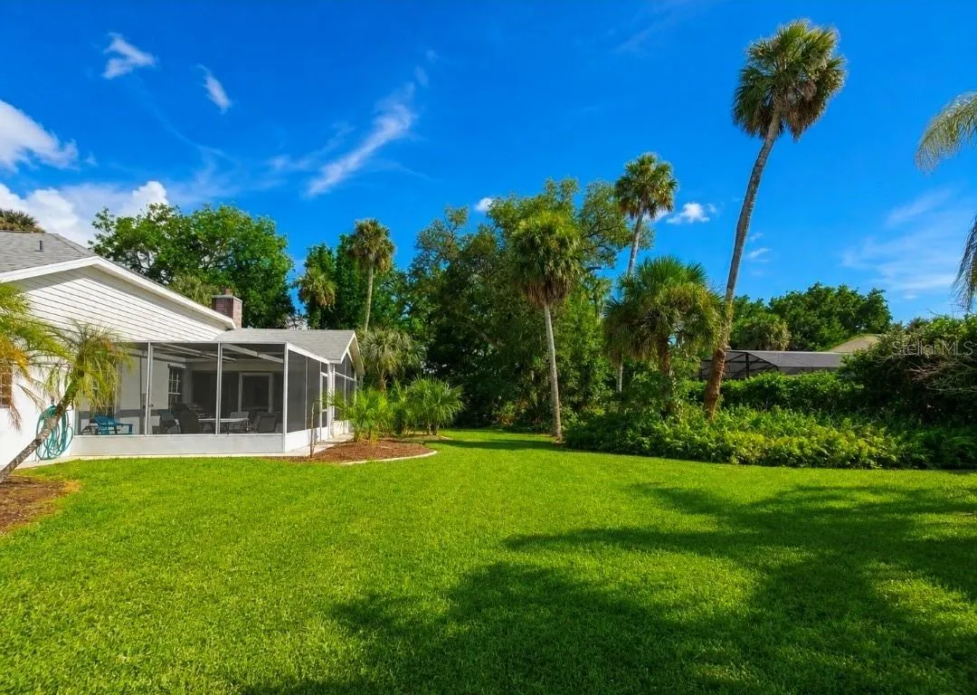 Outside screened porch area, mature landscaping