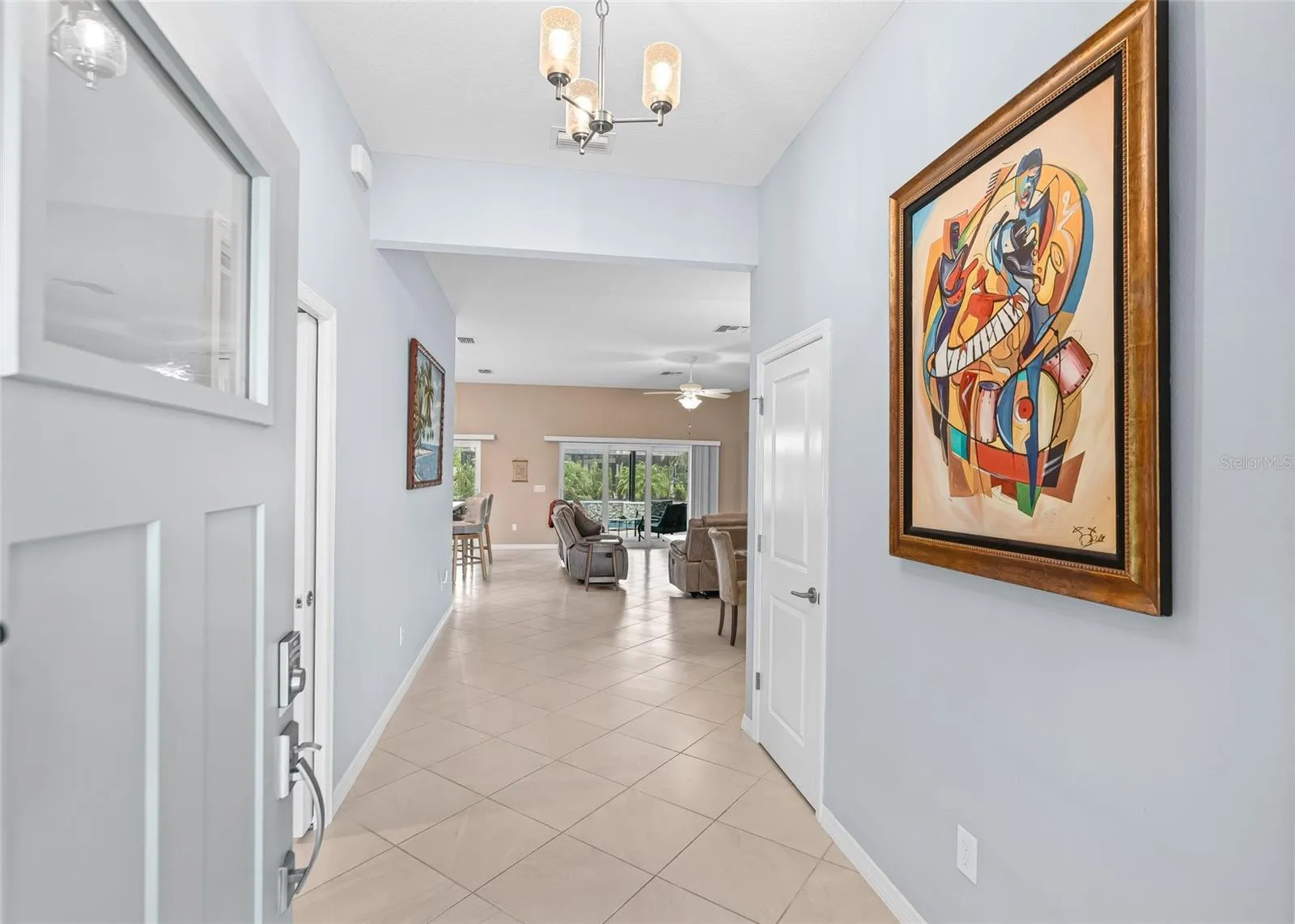 View from Front Door - Hallway with Coat Closet