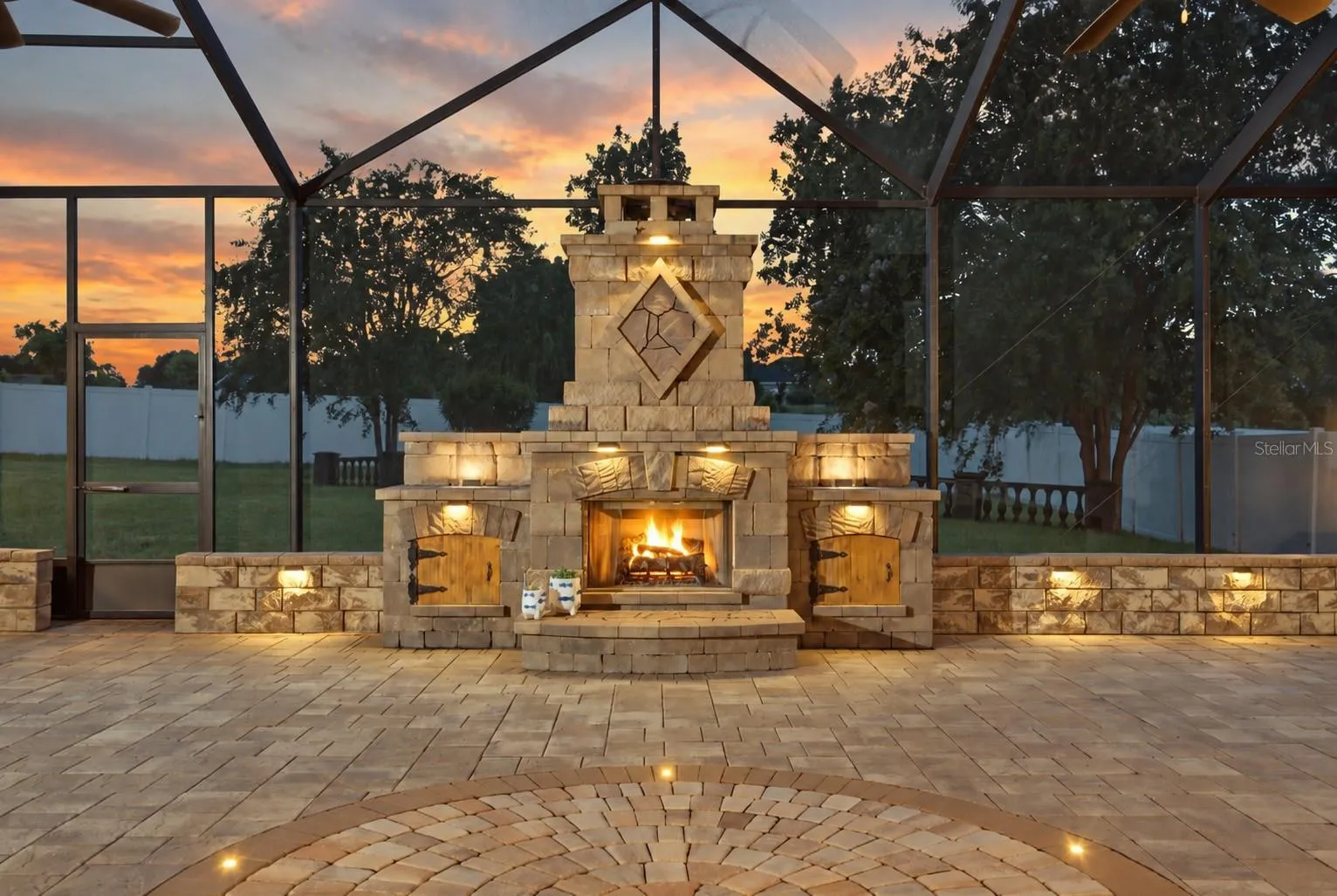 lanai at twilight with waterfalls and fireplace