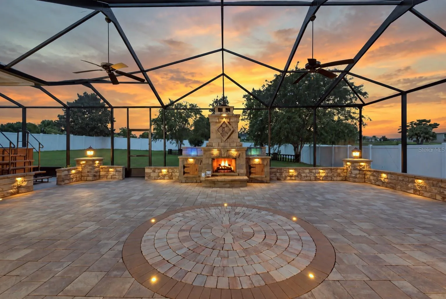 lanai at twilight with waterfalls and fireplace