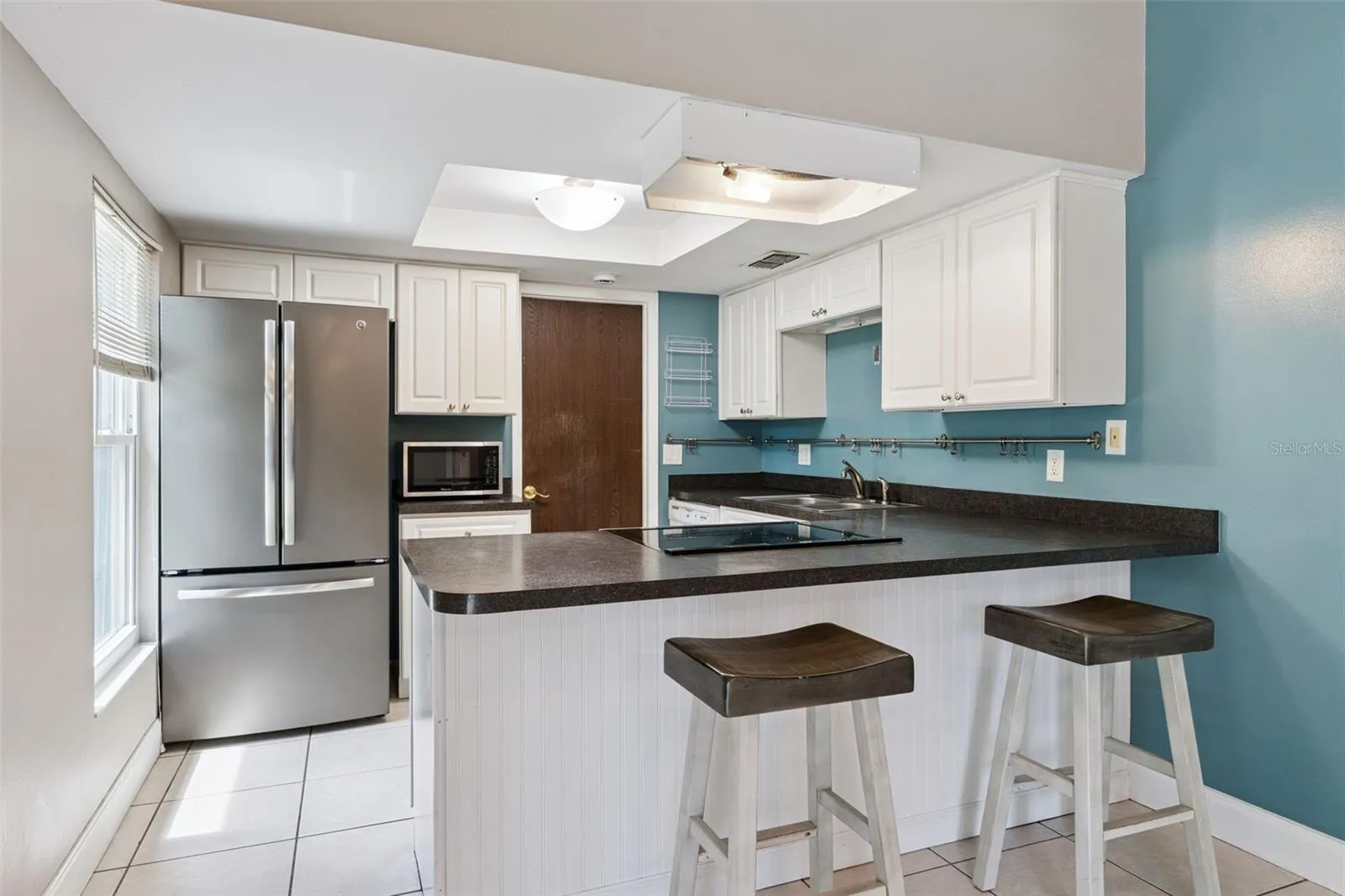 KITCHEN WITH BAR STOOLS