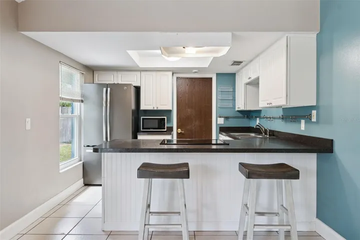 KITCHEN WITH BAR STOOLS