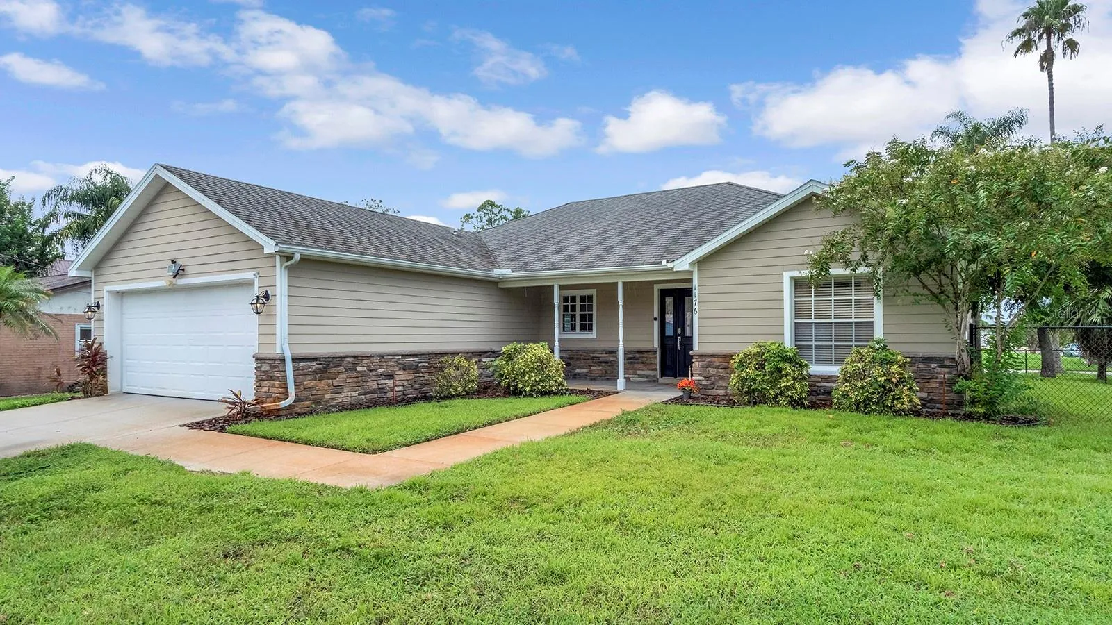 front exterior, on a 1/4 lot