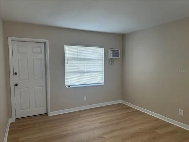 Bedroom (w/ additional  Access to rear parking area