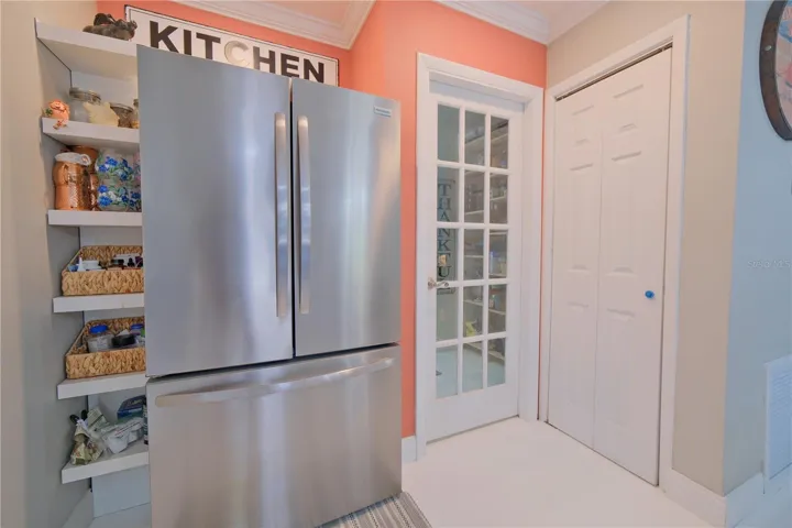 Refrigerator view to Pantry and Laundry Room