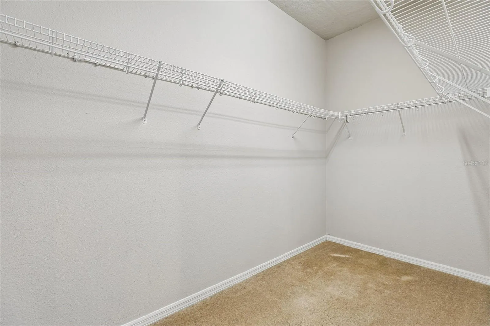 Primary suite walk-in closet.
