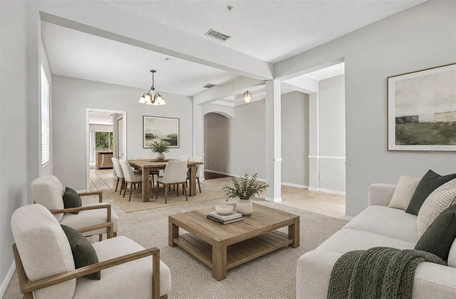 Formal living and dining spaces off the foyer make entertaining a breeze. Virtually Staged.