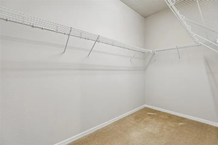 Primary suite walk-in closet.