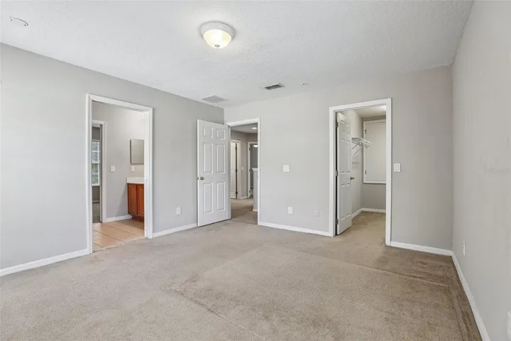 Second bedroom, en-suite access to a shared bath.