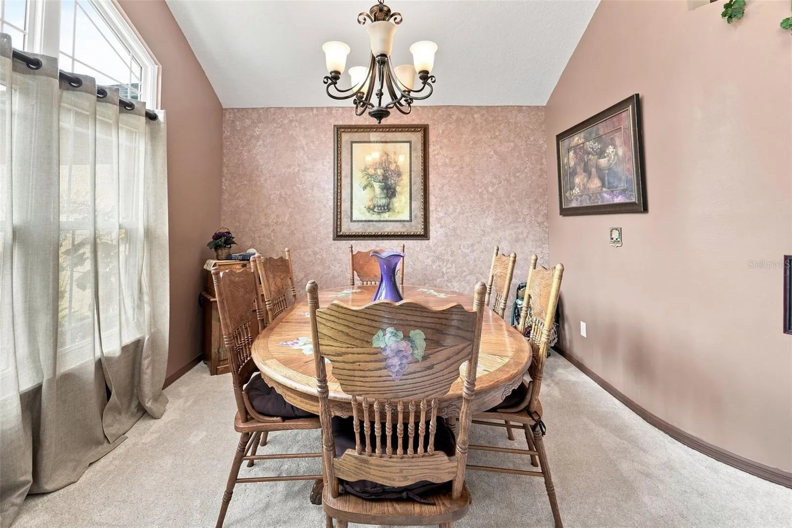 Cozy dining room, kitchen is to the left of entrance. This could make a fantastic office space.