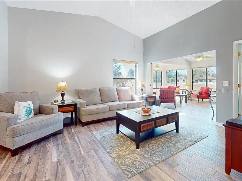 As you enter the front door you have the main living area and can look straight out to the back.
