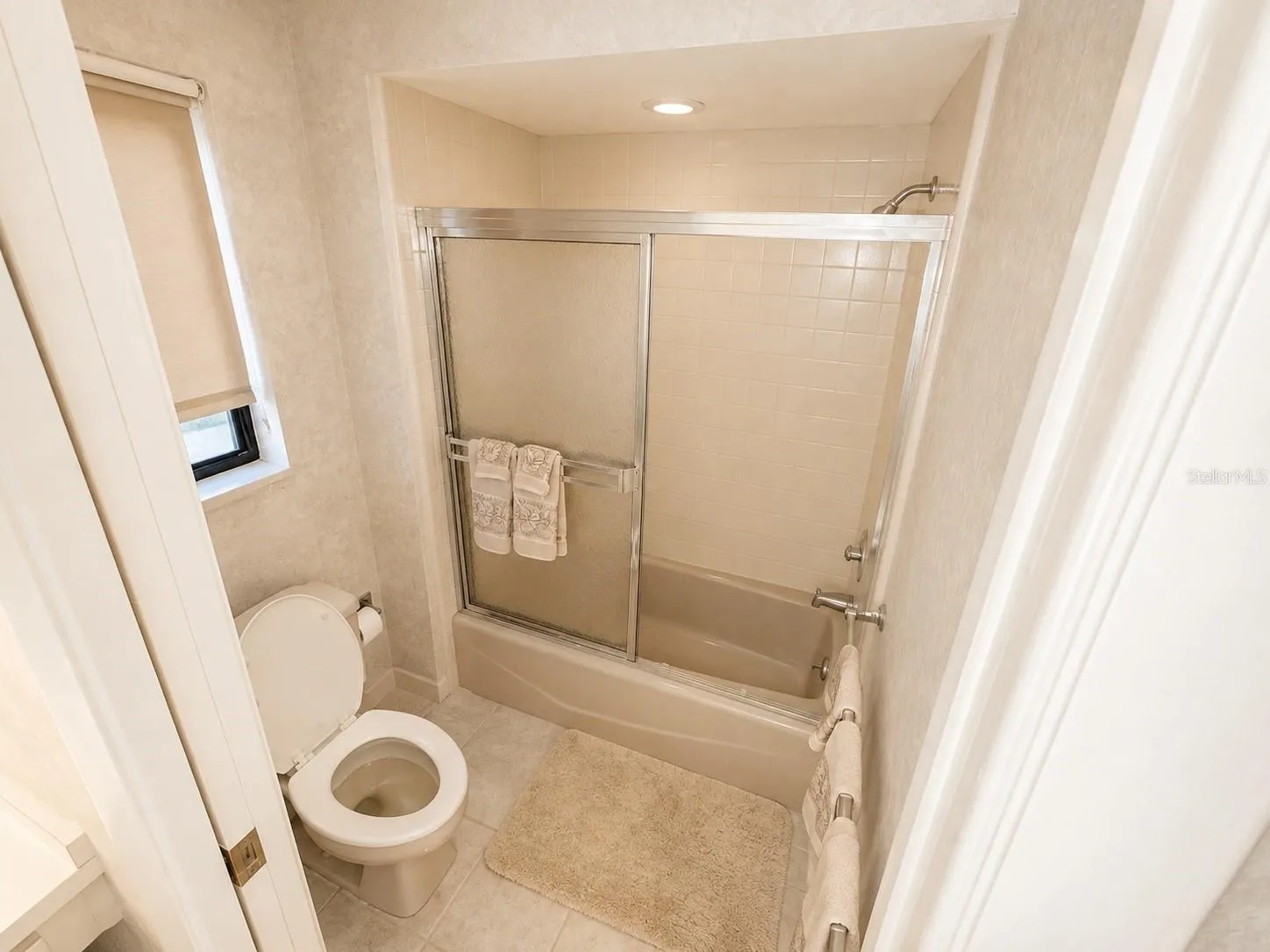 Bedroom 2 with private bathroom. Digitally enhanced