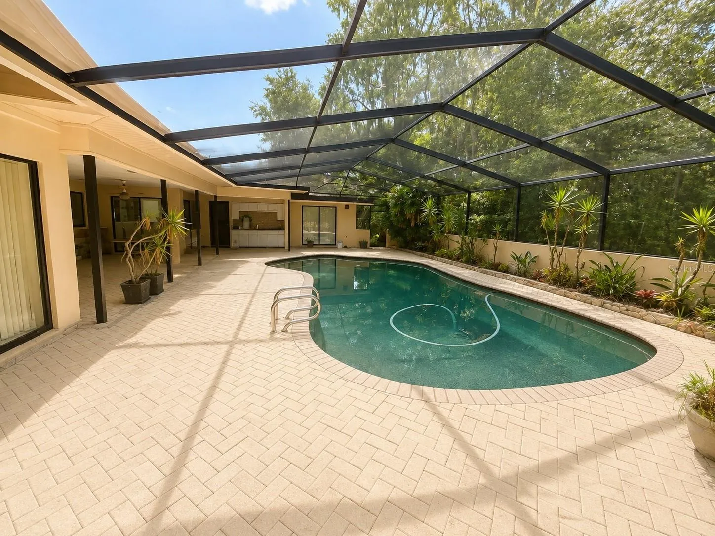 Private screened-in pool. Digitally enhanced