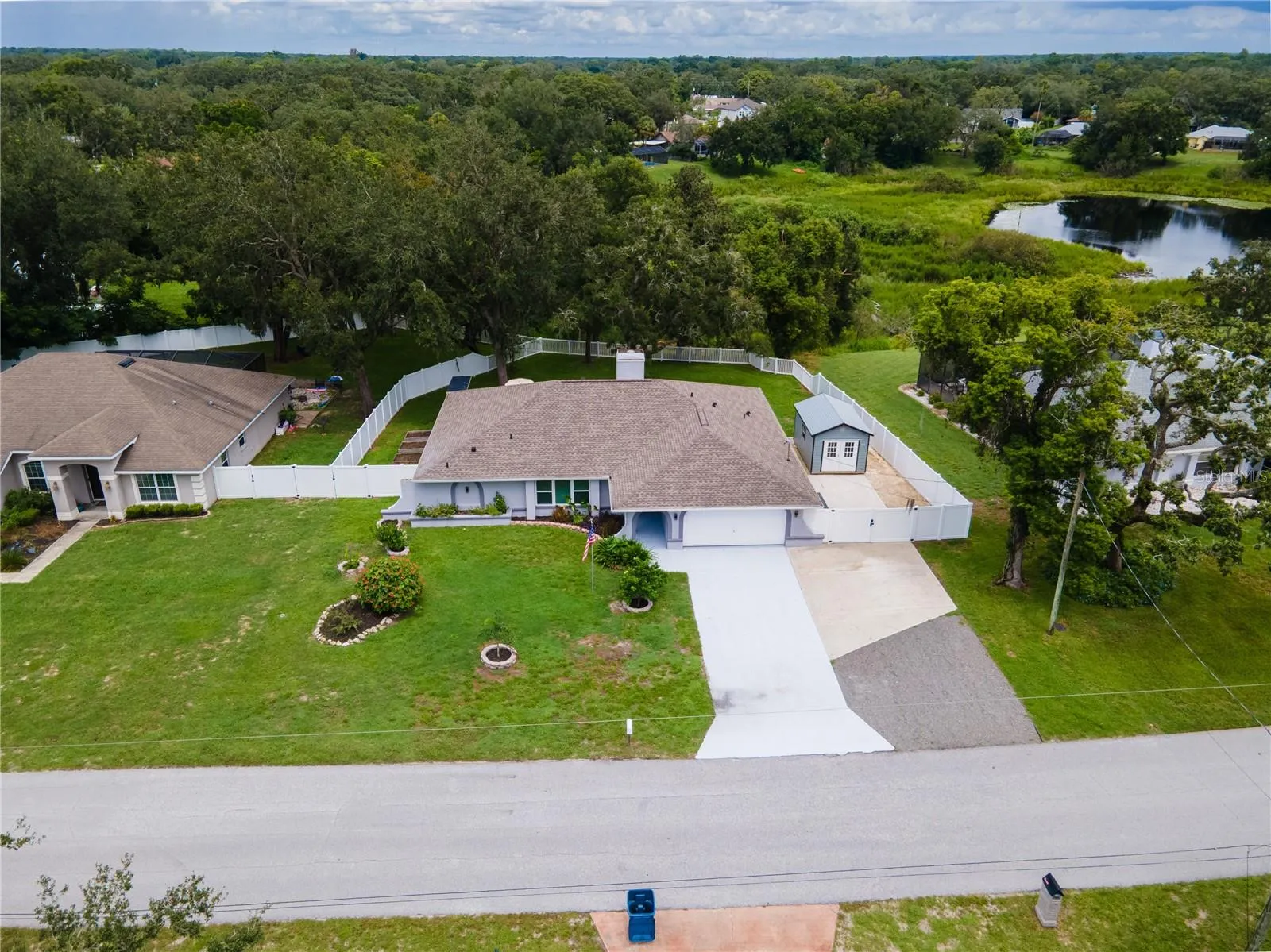 Oversized driveway, fully fenced and gated, overlooks peaceful and serence pond!