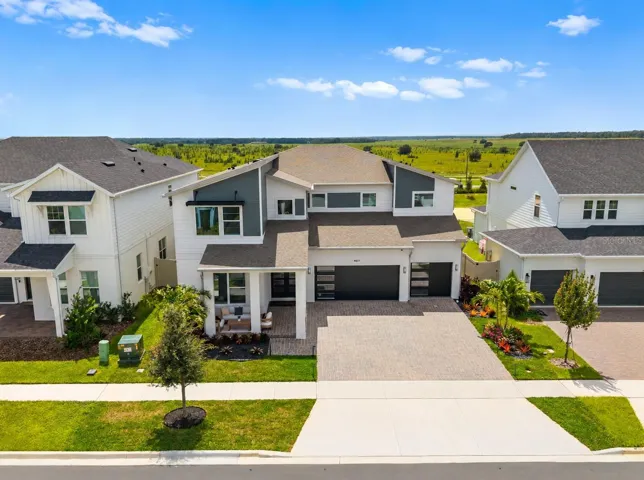 CUSTOM-BUILT IN 2025 and READY NOW in Clermont’s sought-after Parkside Trails!