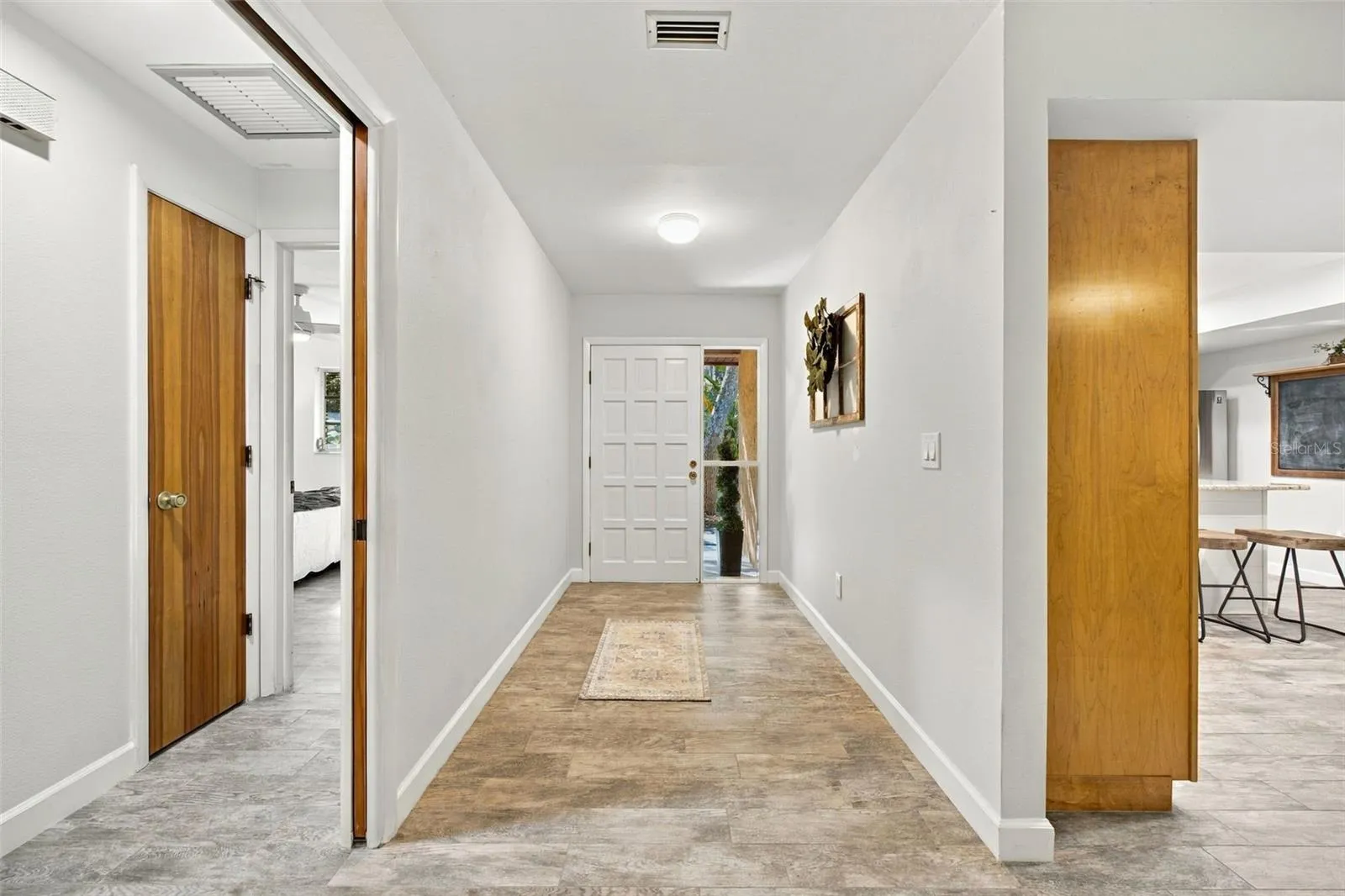 Front Door and hallway to bedroom