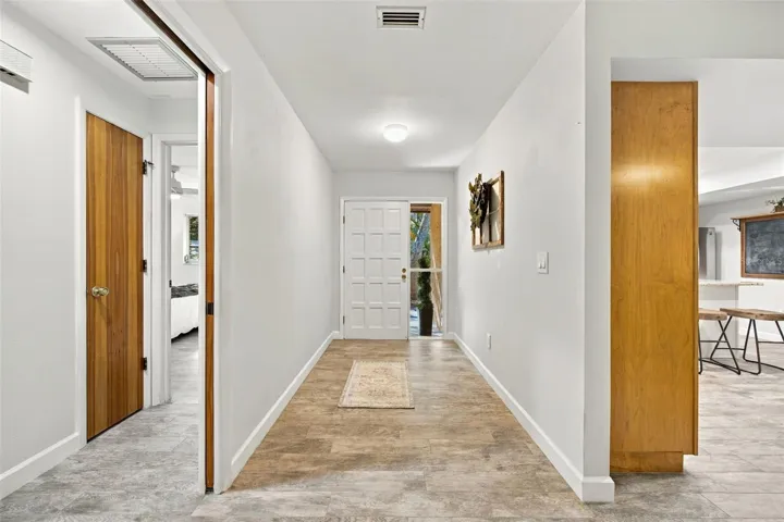 Front Door and hallway to bedroom
