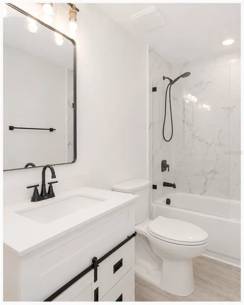 Guest bathroom with shower and tub.