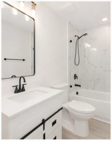 Guest bathroom with shower and tub.