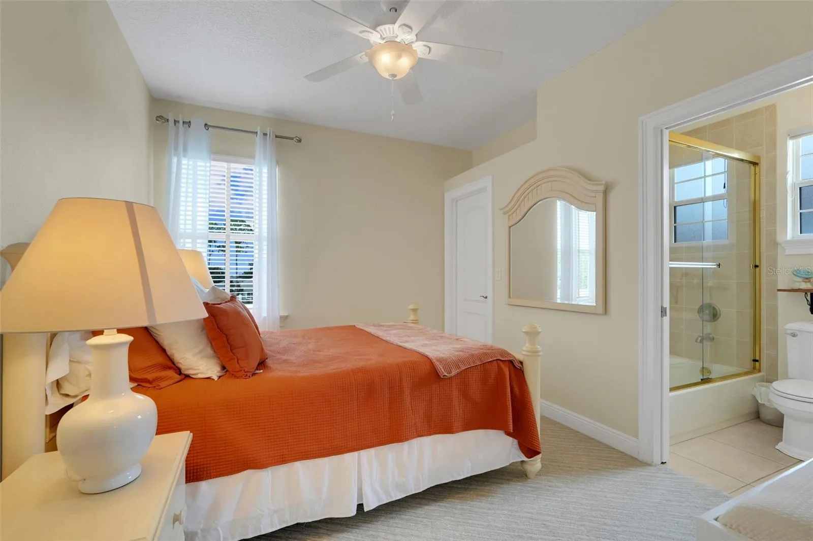 Guest bedroom with it's own full bathroom and walk in closet.