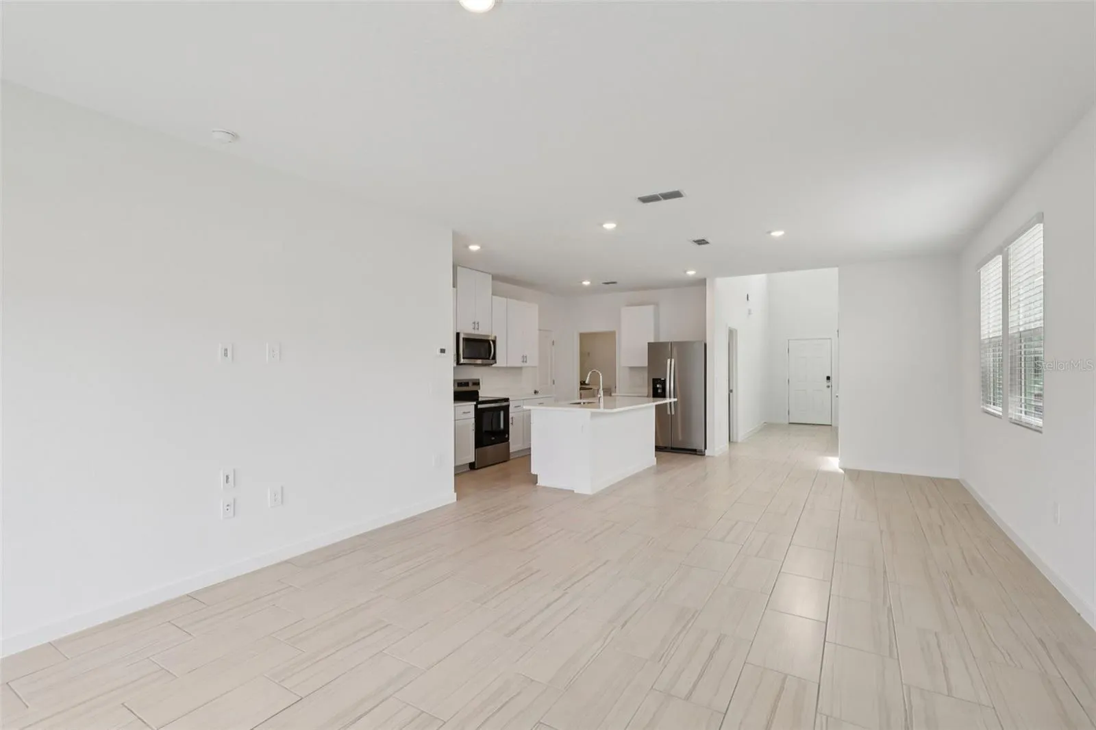 The interior photos are of another home with the same floor plan but different interior color package finishes. Some details may vary