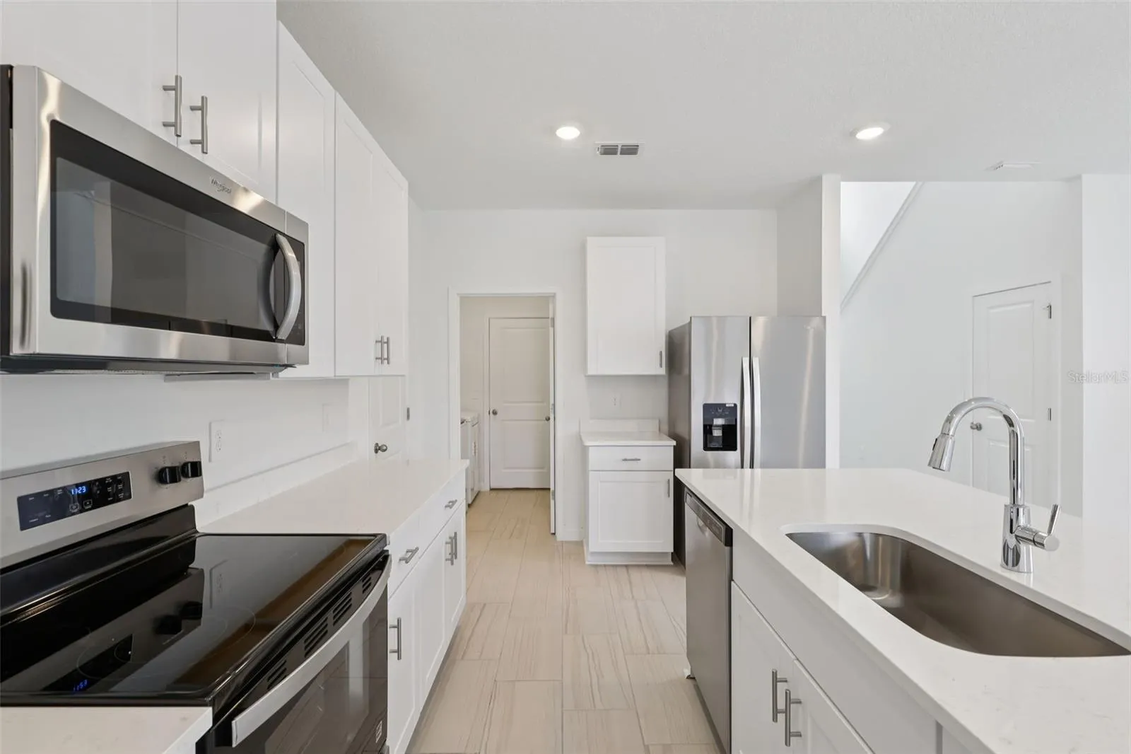 The interior photos are of another home with the same floor plan but different interior color package finishes. Some details may vary