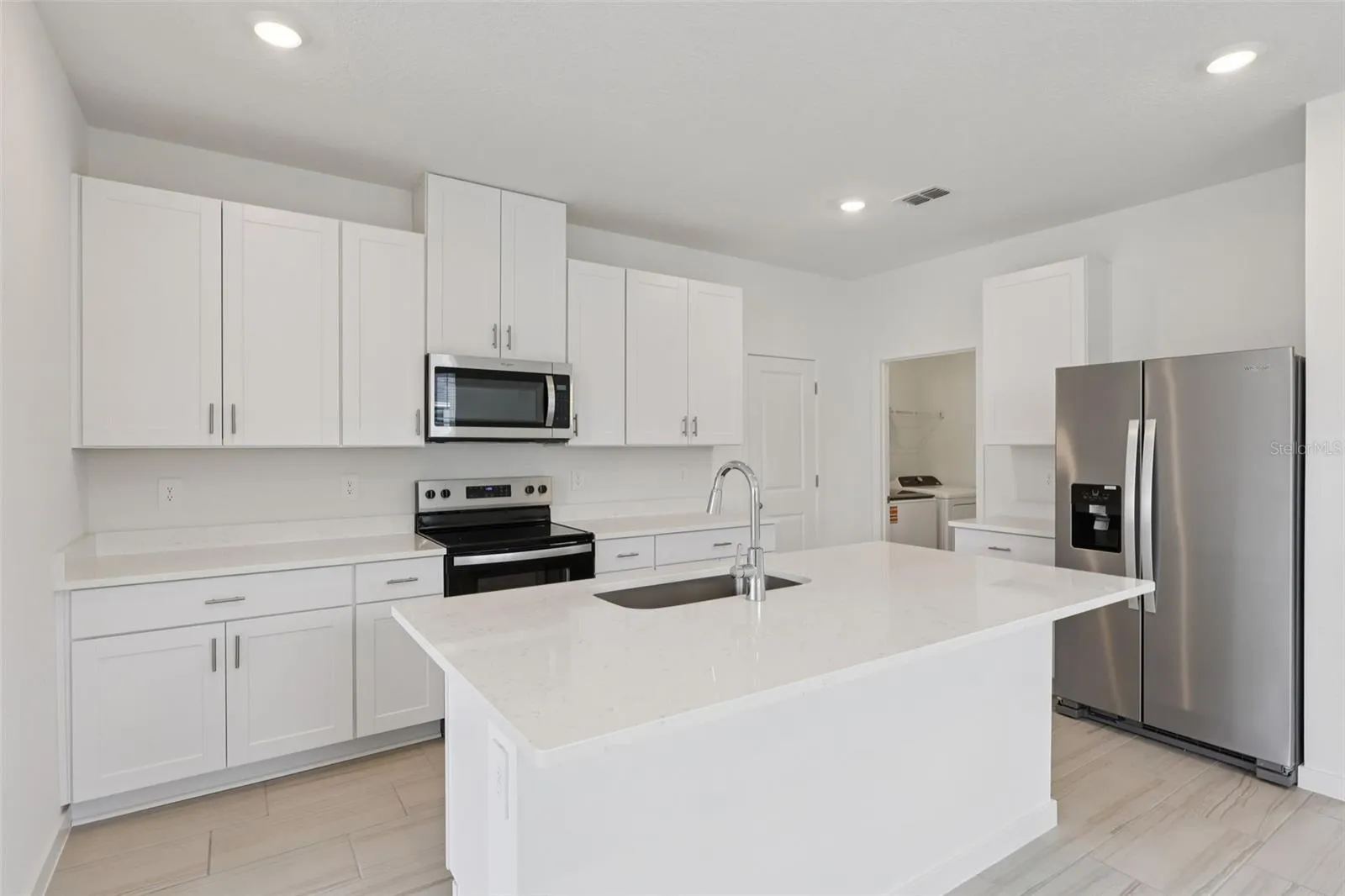 The interior photos are of another home with the same floor plan but different interior color package finishes. Some details may vary