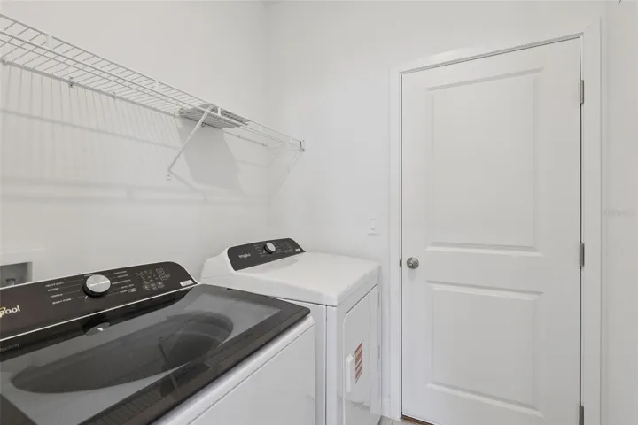 The interior photos are of another home with the same floor plan but different interior color package finishes. Some details may vary