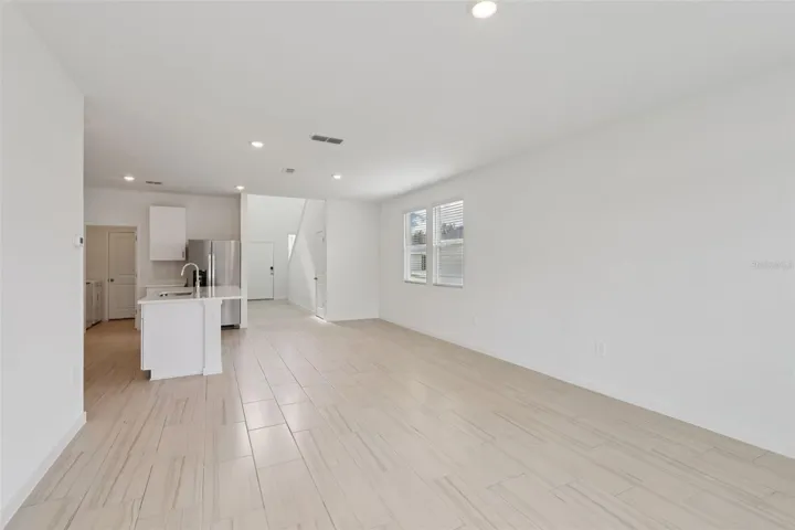 The interior photos are of another home with the same floor plan but different interior color package finishes. Some details may vary