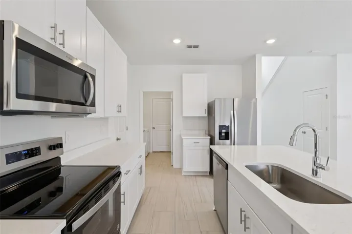 The interior photos are of another home with the same floor plan but different interior color package finishes. Some details may vary