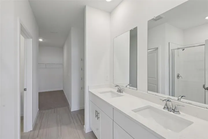 The interior photos are of another home with the same floor plan but different interior color package finishes. Some details may vary