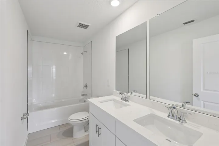 The interior photos are of another home with the same floor plan but different interior color package finishes. Some details may vary