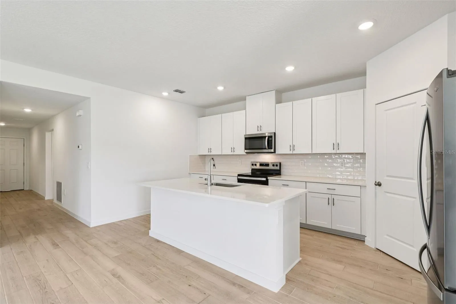 The interior photos are of another home with the same floor plan but different interior color package finishes. Some details may vary