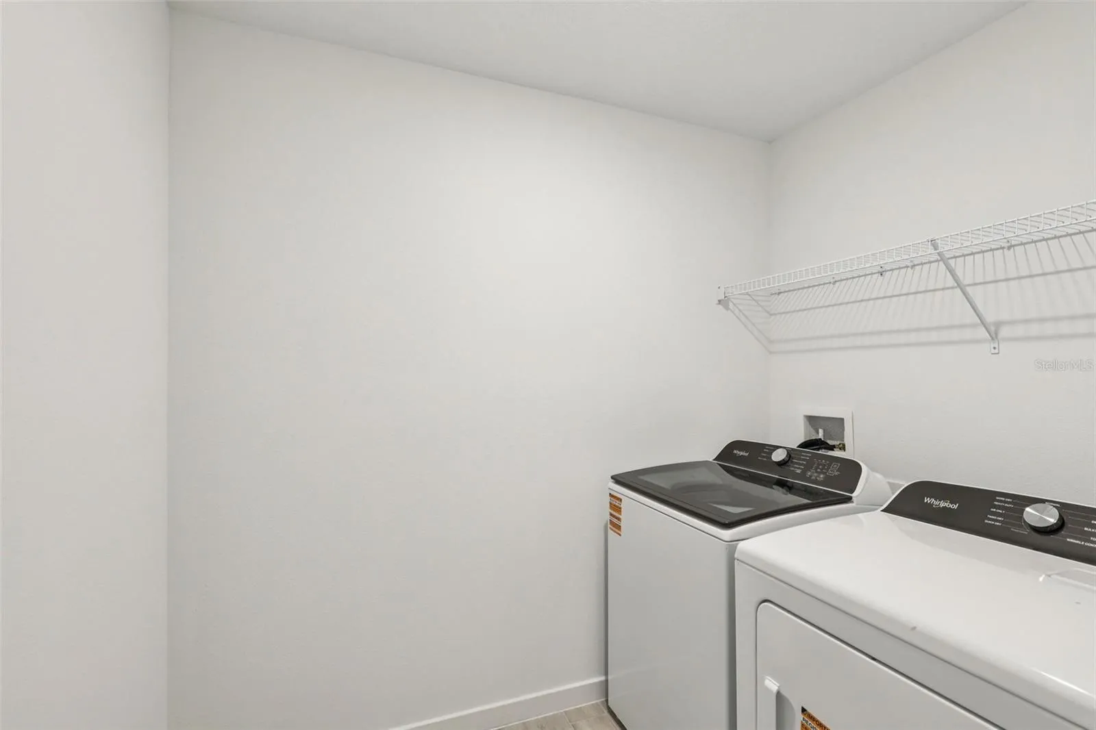 The interior photos are of another home with the same floor plan but different interior color package finishes. Some details may vary