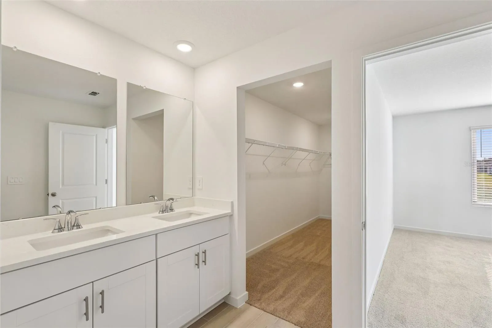 The interior photos are of another home with the same floor plan but different interior color package finishes. Some details may vary