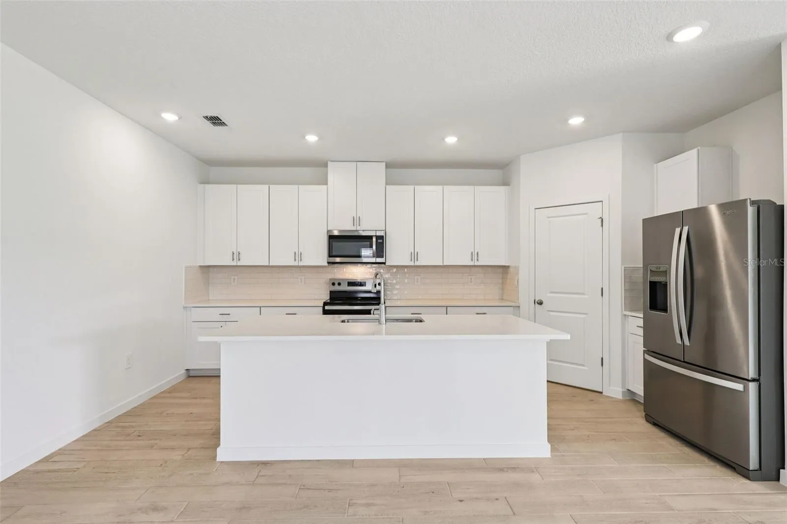 The interior photos are of another home with the same floor plan but different interior color package finishes. Some details may vary