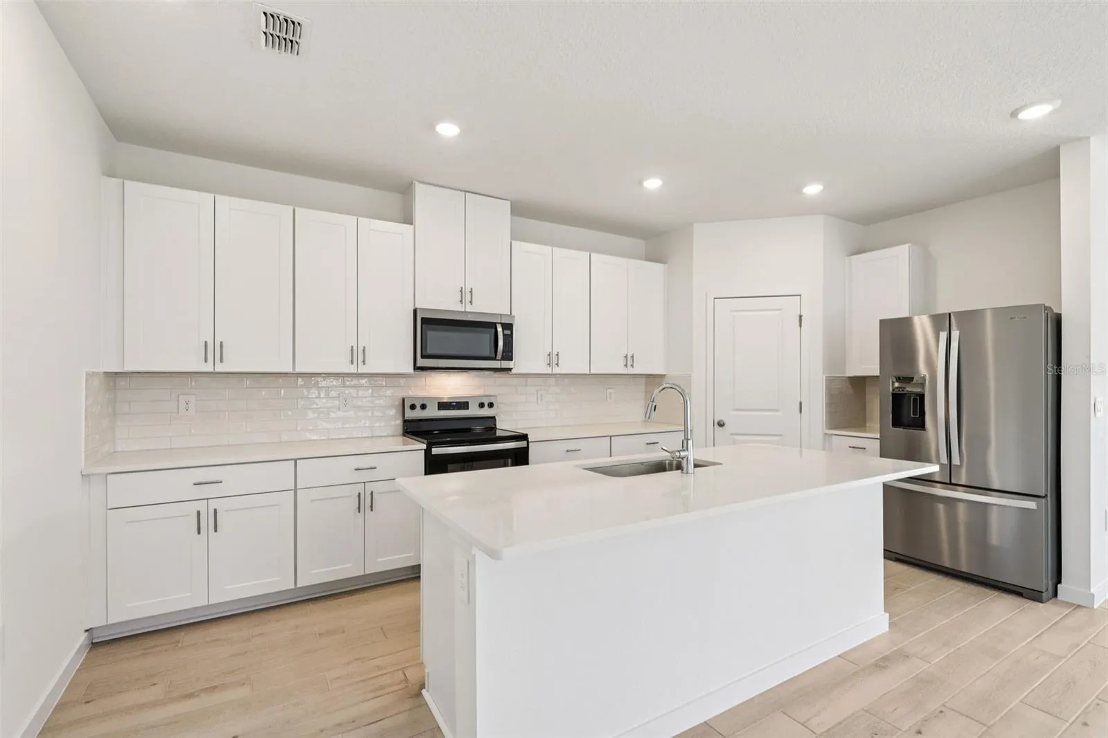 The interior photos are of another home with the same floor plan but different interior color package finishes. Some details may vary