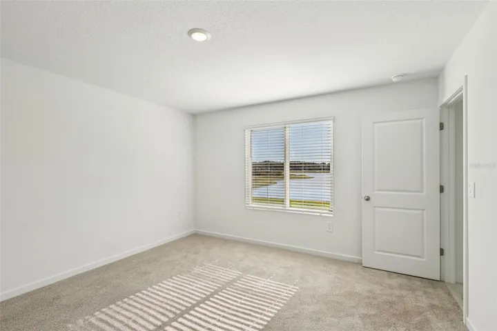 The interior photos are of another home with the same floor plan but different interior color package finishes. Some details may vary
