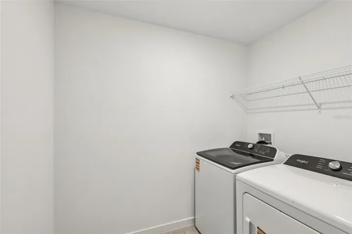 The interior photos are of another home with the same floor plan but different interior color package finishes. Some details may vary