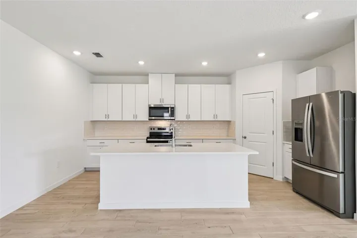 The interior photos are of another home with the same floor plan but different interior color package finishes. Some details may vary
