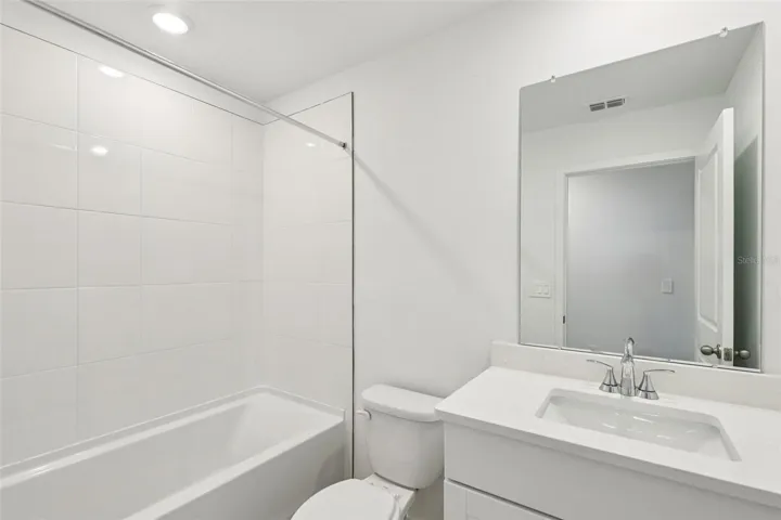 The interior photos are of another home with the same floor plan but different interior color package finishes. Some details may vary