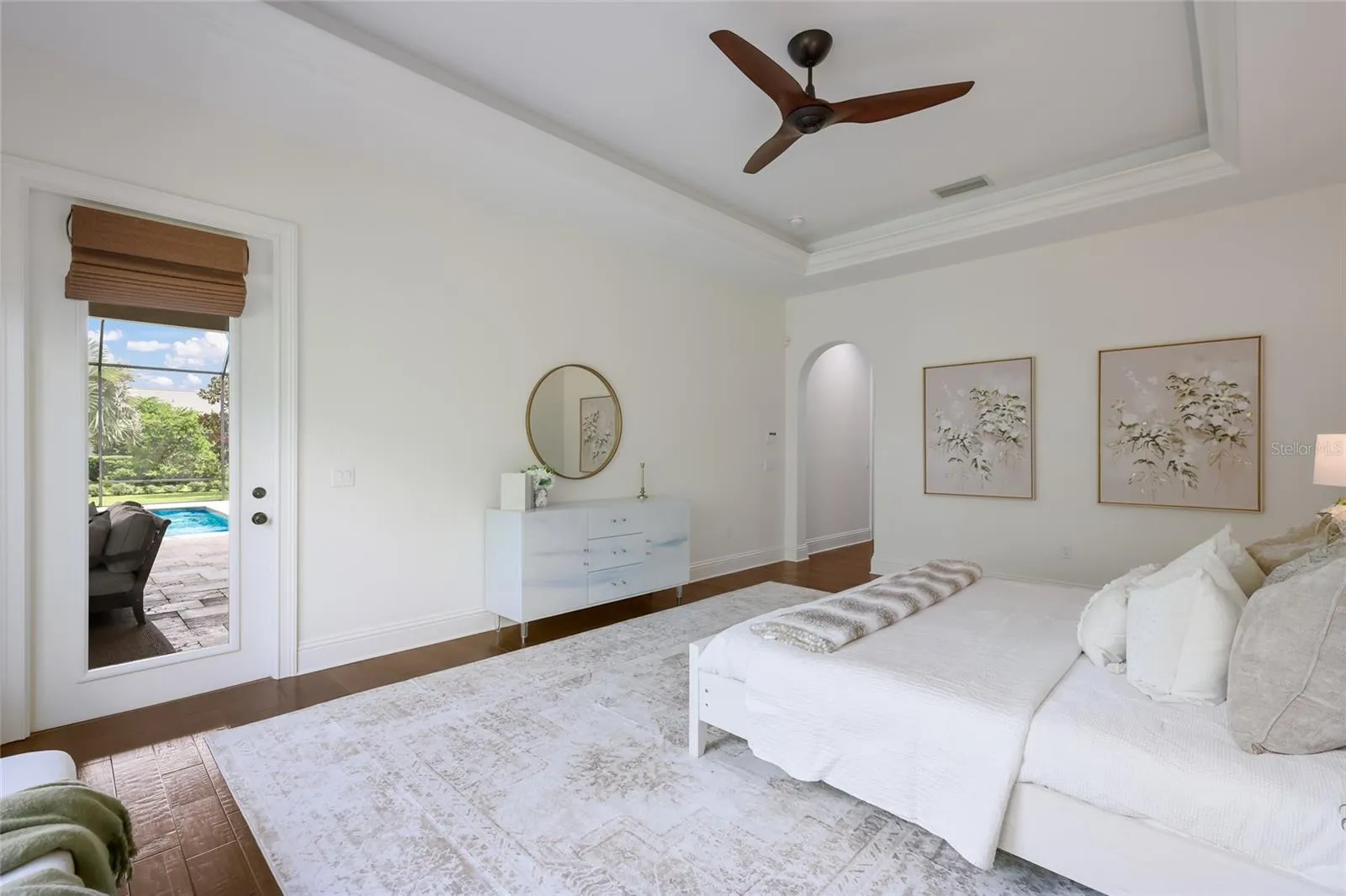 Primary suite has tray ceilings and private access to lanai.