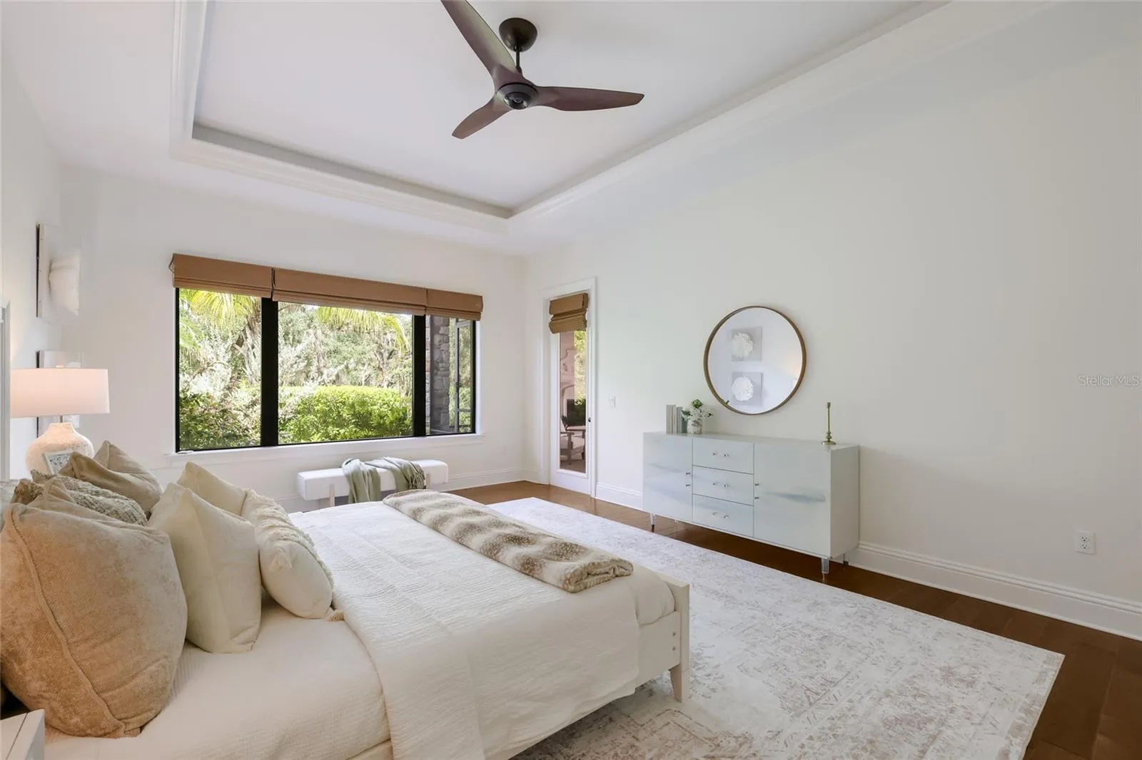 Primary suite has tray ceilings and private access to lanai.