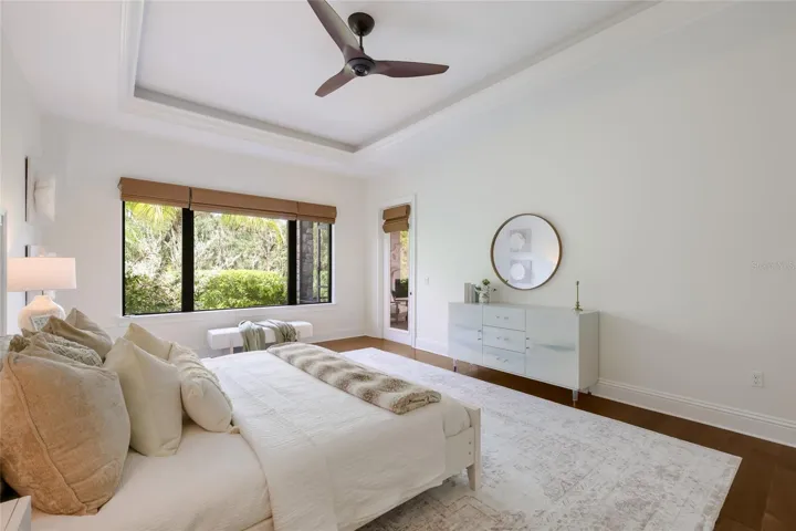 Primary suite has tray ceilings and private access to lanai.