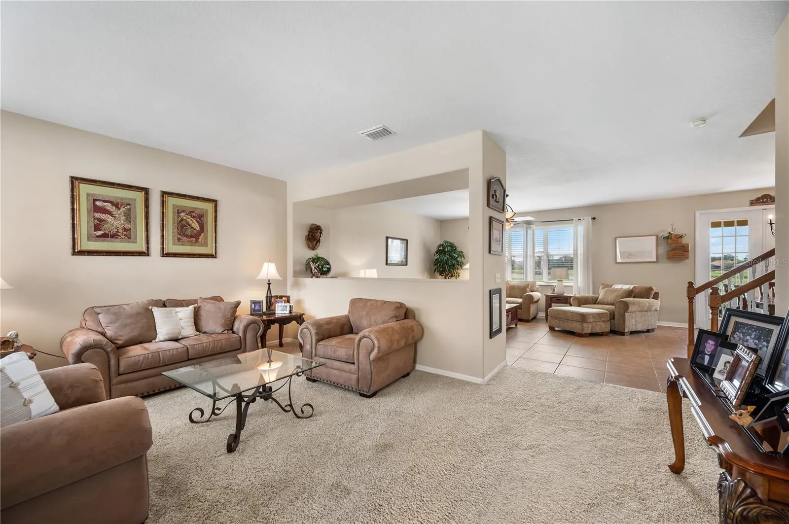 As you enter ,the view from the front to the rear of the home is spectacular. The Open floor plan lends itself to seamless entertaining and family fun.