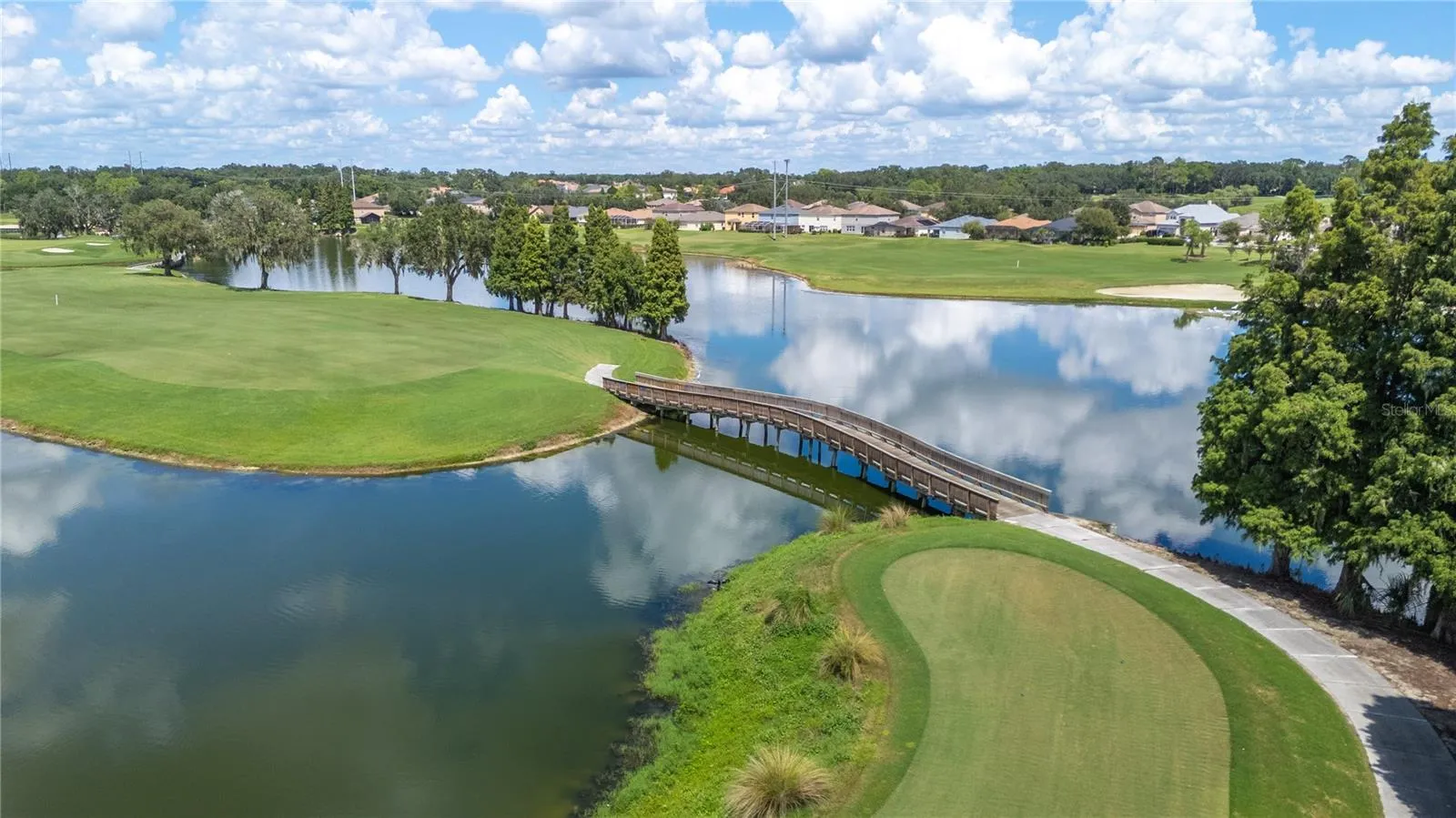The 15th hole and bridge to the 14th hole on the golf course at The Club at Eaglebrooke