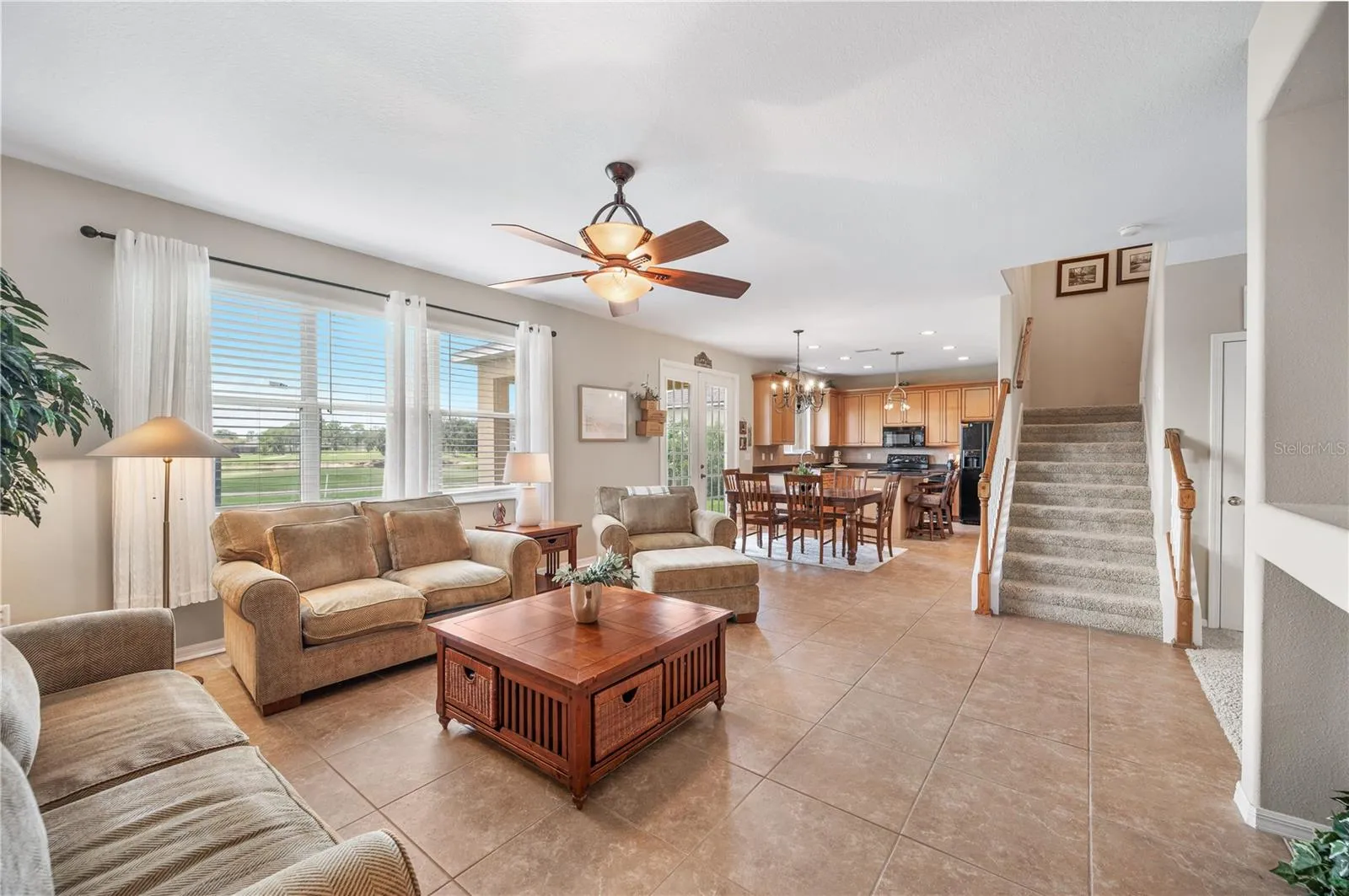 From the family room into the dining space and kitchen beyond!