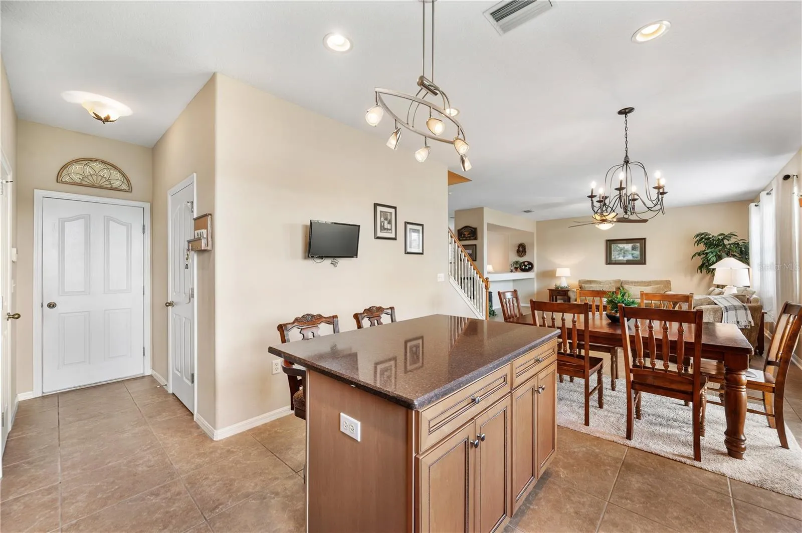 Right of f the kitchen is a well appointed half bathroom and exit to a large 2 car garage .